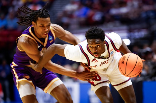 Ian Jackson #11 of St. John's gets past Geon Hutchins #2 of Northern Iowa during the first round of the 2026 NCAA Men's Basketball Tournament at Viejas Arena on Friday, March 20, 2026 in San Diego, California. (Meg McLaughlin / The San Diego Union-Tribune)