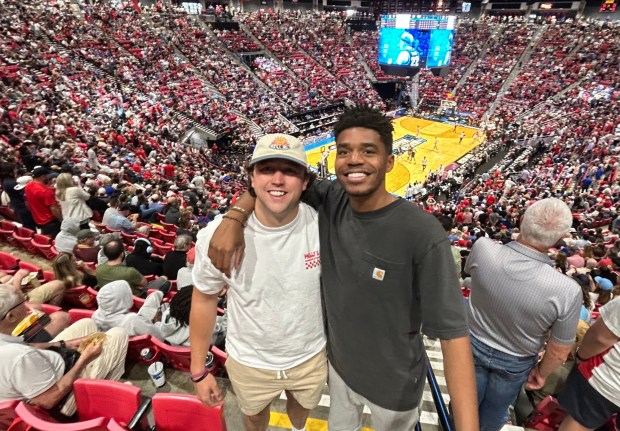 Kirf Olander, left, and Xander Roker smile during Sunday's NCAA Tournament Round of 32 games at Viejas Arena. (Kirk Kenney / San Diego Union-Tribune)
