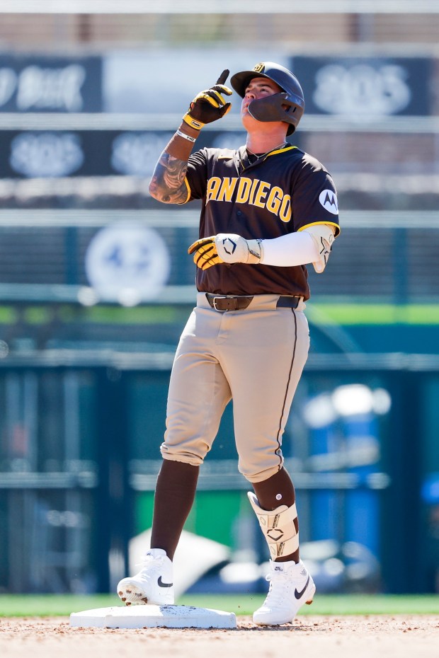 Jose Miranda #64 of the San Diego Padres celebrates his double during their spring training game against the White Sox at Camelback Ranch on Tuesday, March 3, 2026 in Phoenix, Ariz. (Meg McLaughlin / The San Diego Union-Tribune)