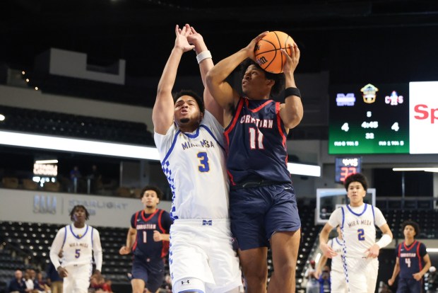 Christian High's Alex Williams shoots against Mira Mesa High's Jase Davis during the CIF Division 1 championship at Frontwave Arena in Oceanside on Saturday, Feb. 28, 2026. The Marauders defeated the Patriots 63-55. (Kristian Carreon / The San Diego Union-Tribune)