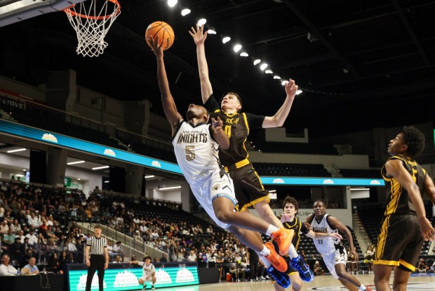 Victory Christian's Jayden Gray in action with Francis Parker's Ezekiel Walker during the CIF Open Division championship at Frontwave Arena in Oceanside on Saturday, Feb. 28, 2026. Victory Christian Academy defeated Francis Parker 57-54. (Kristian Carreon / The San Diego Union-Tribune)