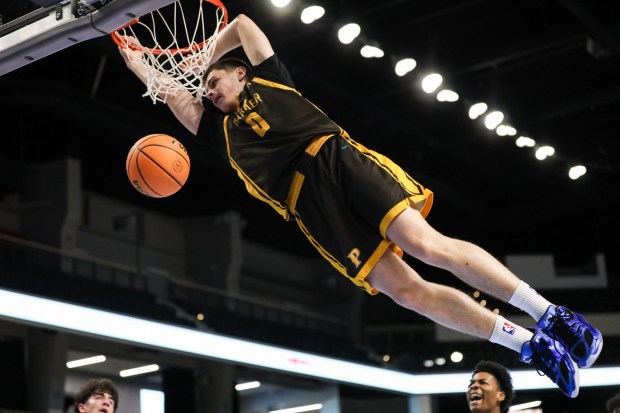 Francis Parker's Ezekiel Walker drunks the ball against Victory Christian during the CIF Open Division championship at Frontwave Arena in Oceanside on Saturday, Feb. 28, 2026. Victory Christian Academy defeated Francis Parker 57-54. (Kristian Carreon / The San Diego Union-Tribune)