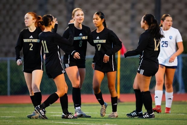Westview's Ally Damron #17, center, and teammates celebrate after a goal against Granite Hills during their game at Westview High School on Wednesday, Feb. 18, 2026 in San Diego, California. (Meg McLaughlin / The San Diego Union-Tribune)