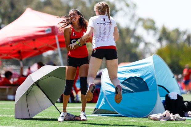 Canyon Crest's Amaya Estes celebrates with teammates after competing in long jump during the Sundevil Invitational at Mt. Carmel High School on Saturday, March 28, 2026 in San Diego, California. (Meg McLaughlin / The San Diego Union-Tribune)