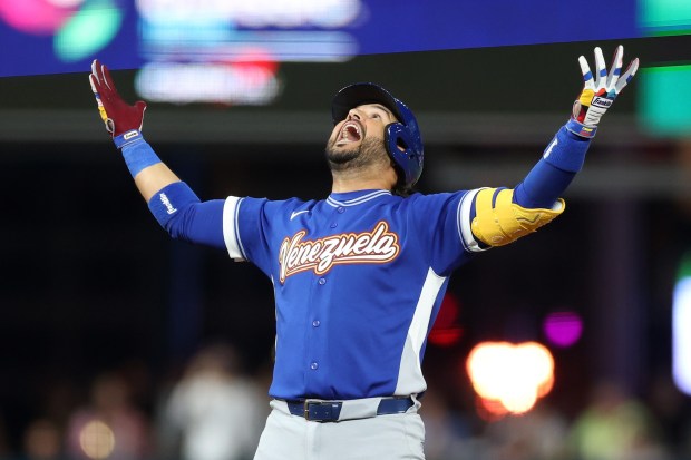 Eugenio SuÃ¡rez #7 of Team Venezuela reacts after hitting an RBI double against Team United States during the ninth inning at loanDepot park on March 17, 2026 in Miami, Florida. (Photo by Al Bello/Getty Images)