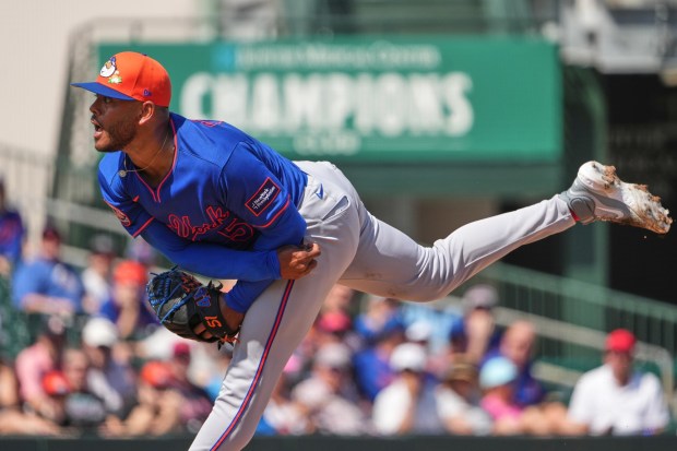 New York Mets starting pitcher Freddy Peralta throws during the first inning of a spring training baseball game against the St. Louis Cardinals Friday, Feb. 27, 2026, in Jupiter, Fla. (AP Photo/Jeff Roberson)
