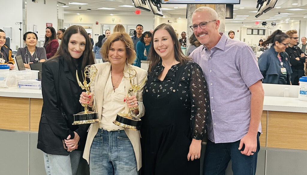 Casting directors Cathy Sandrich Gelfond and Erica Berger celebrate their Emmy wins on the set of The Pitt with showrunner R. Scott Gemmill.