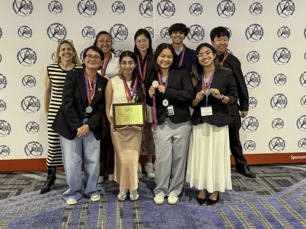 Stockdales's team shows off their medals.