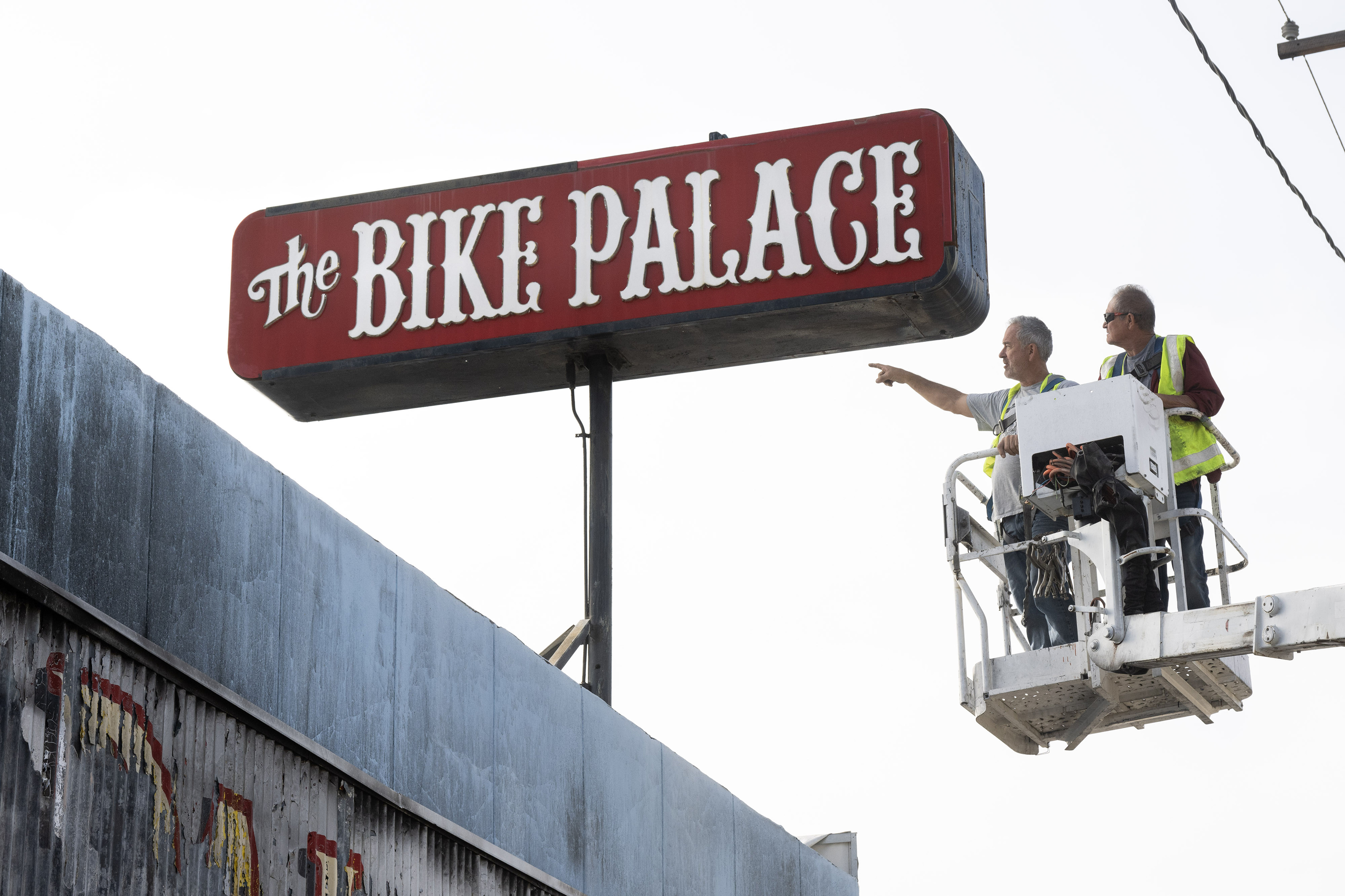 From left, Randy Weston and Tony Paze prepare to remove...