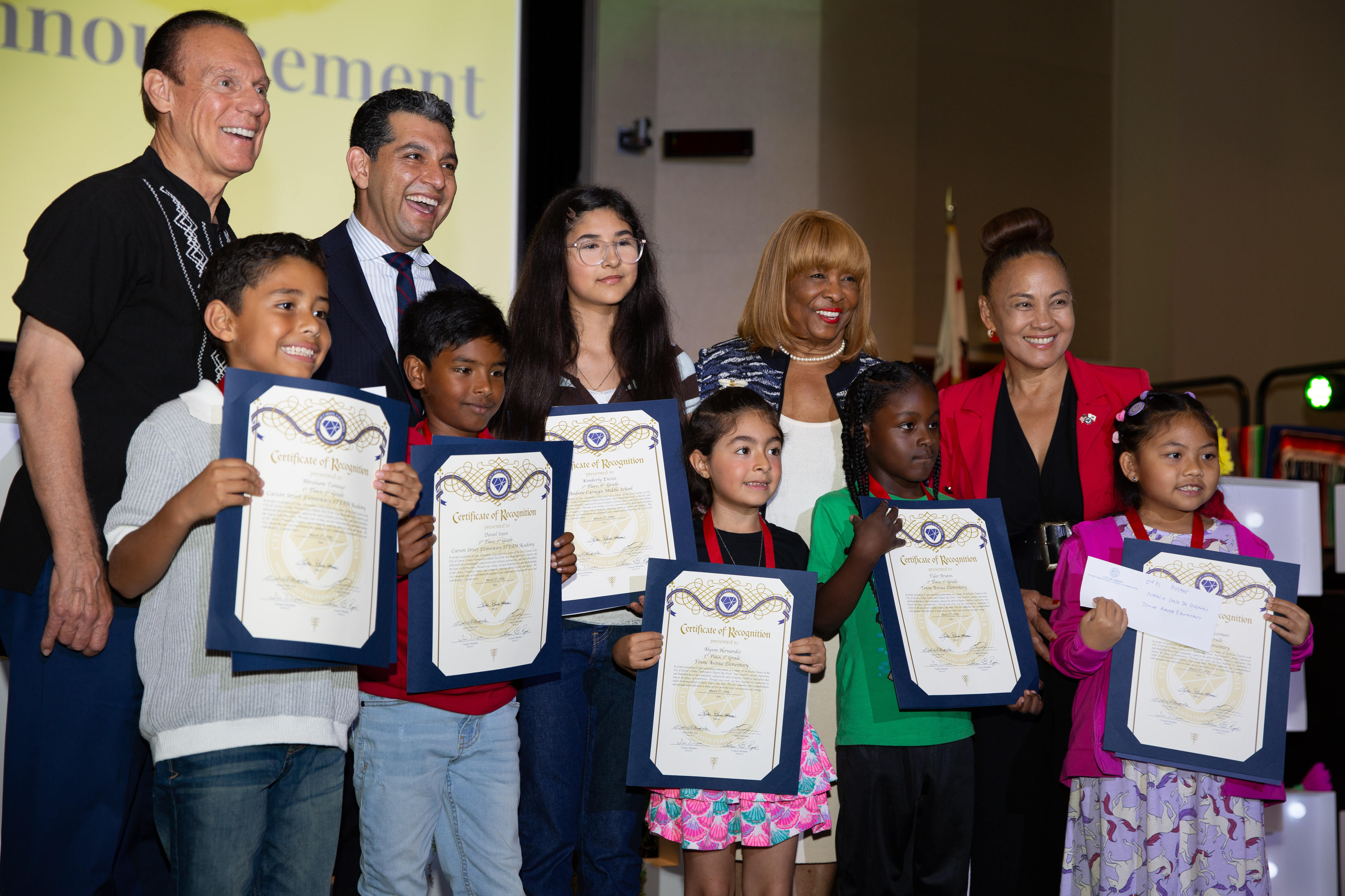 Elementary school students take a group photo with city officials...