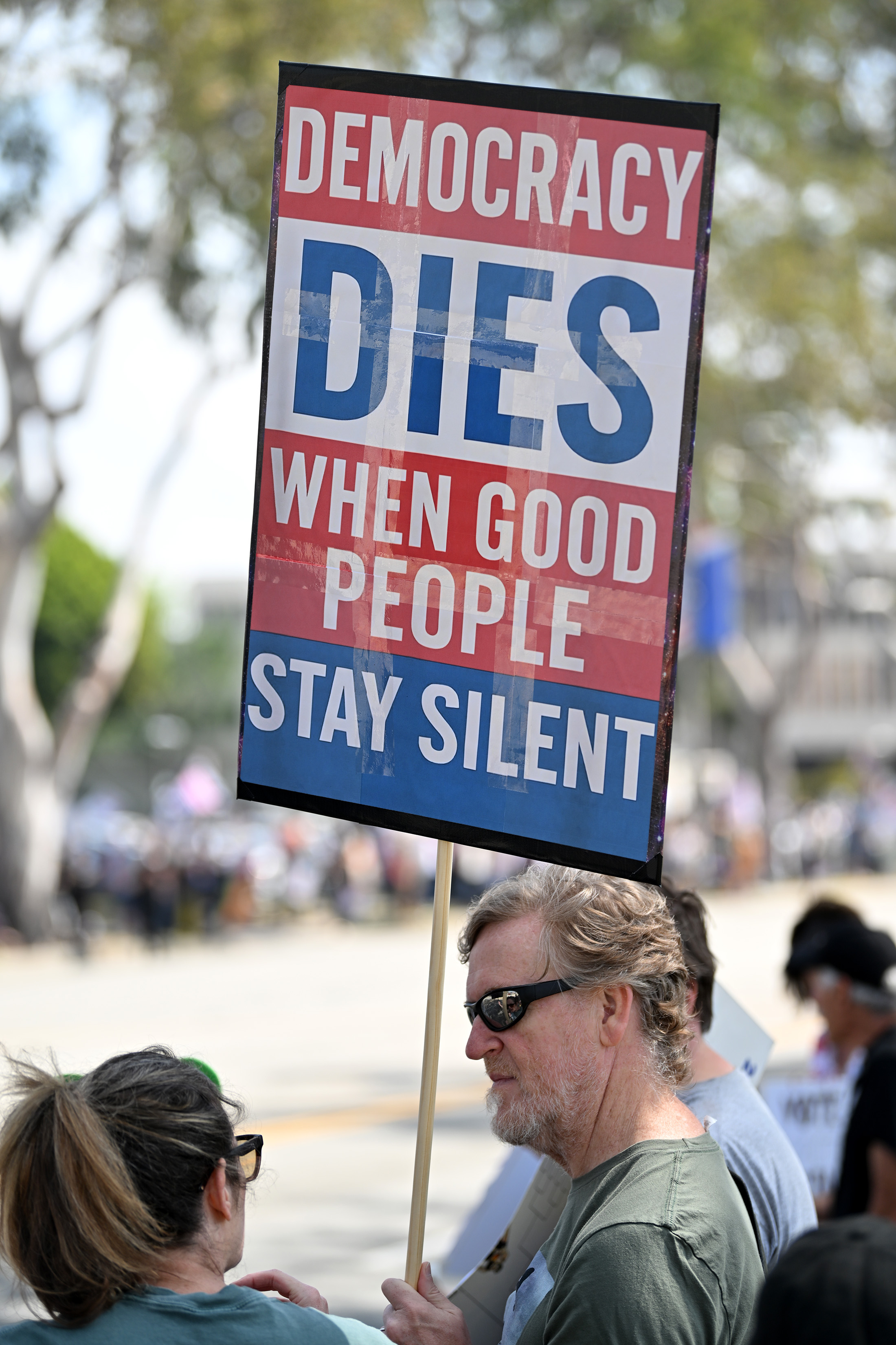 “No Kings” protesters in Torrance express their opposition to the...