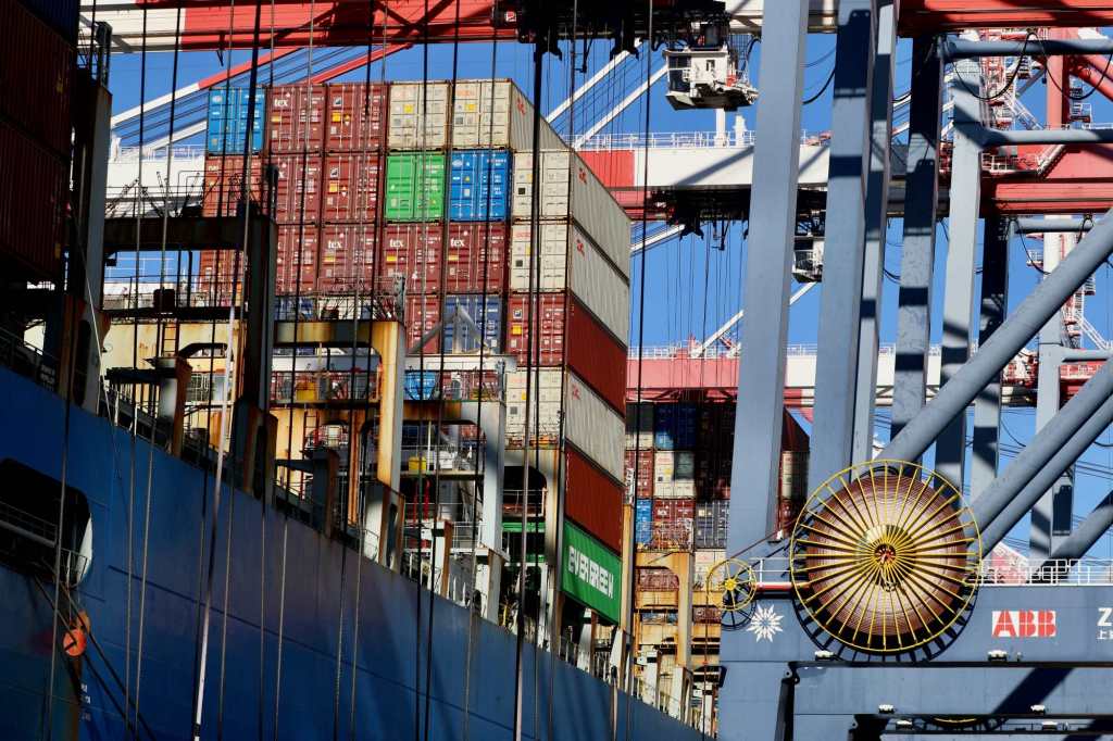 Cargo containers, some damaged, being offloaded from ship at Port of Long Beach after rough voyage – Press Telegram