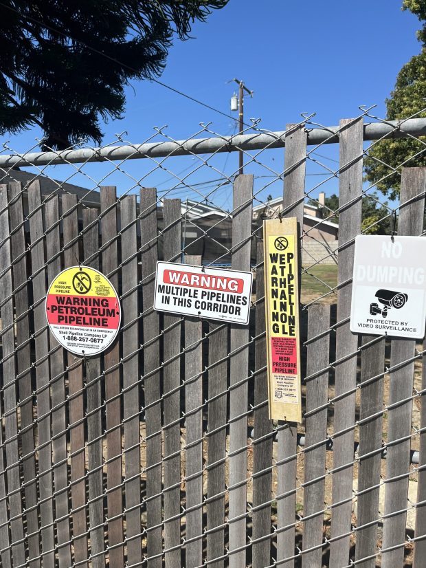 Signs posted outside of the Phillips 66 Carson refinery. (Photo courtesy of APEN)