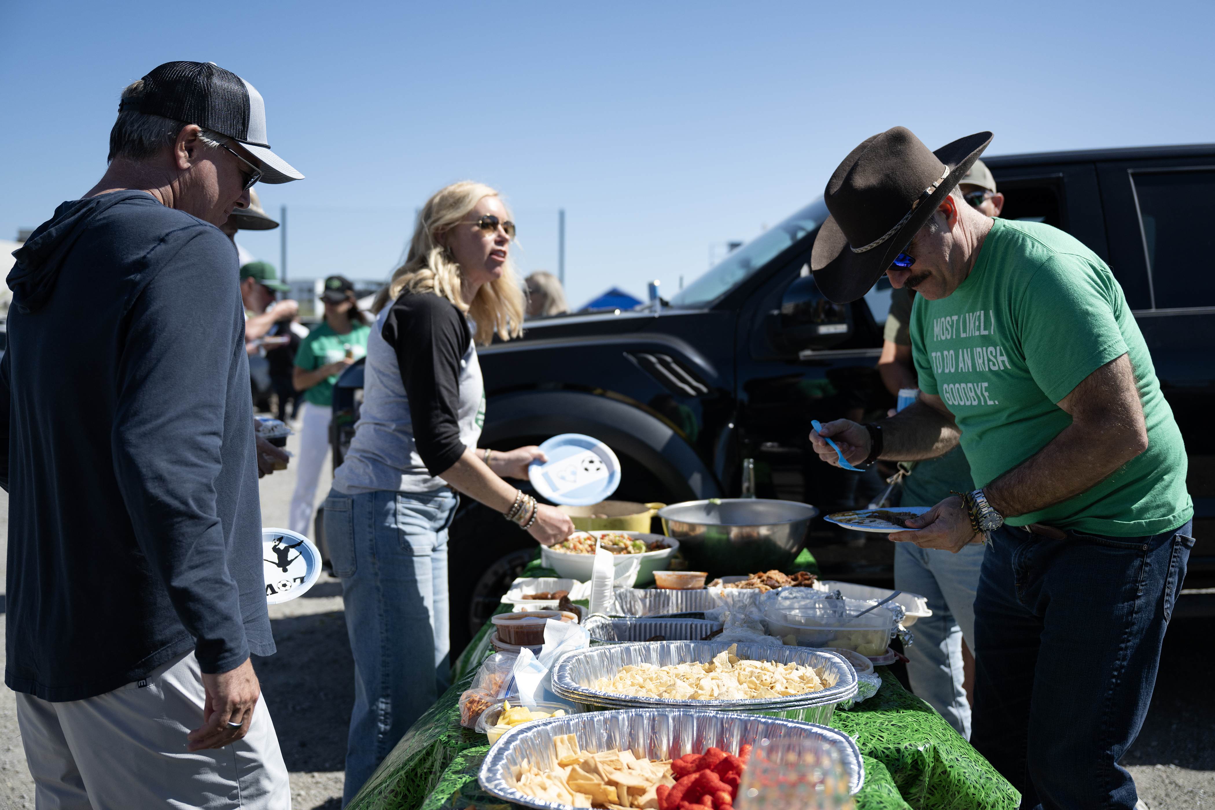 Bob, right, and Wendy Means, second to left, parents of...