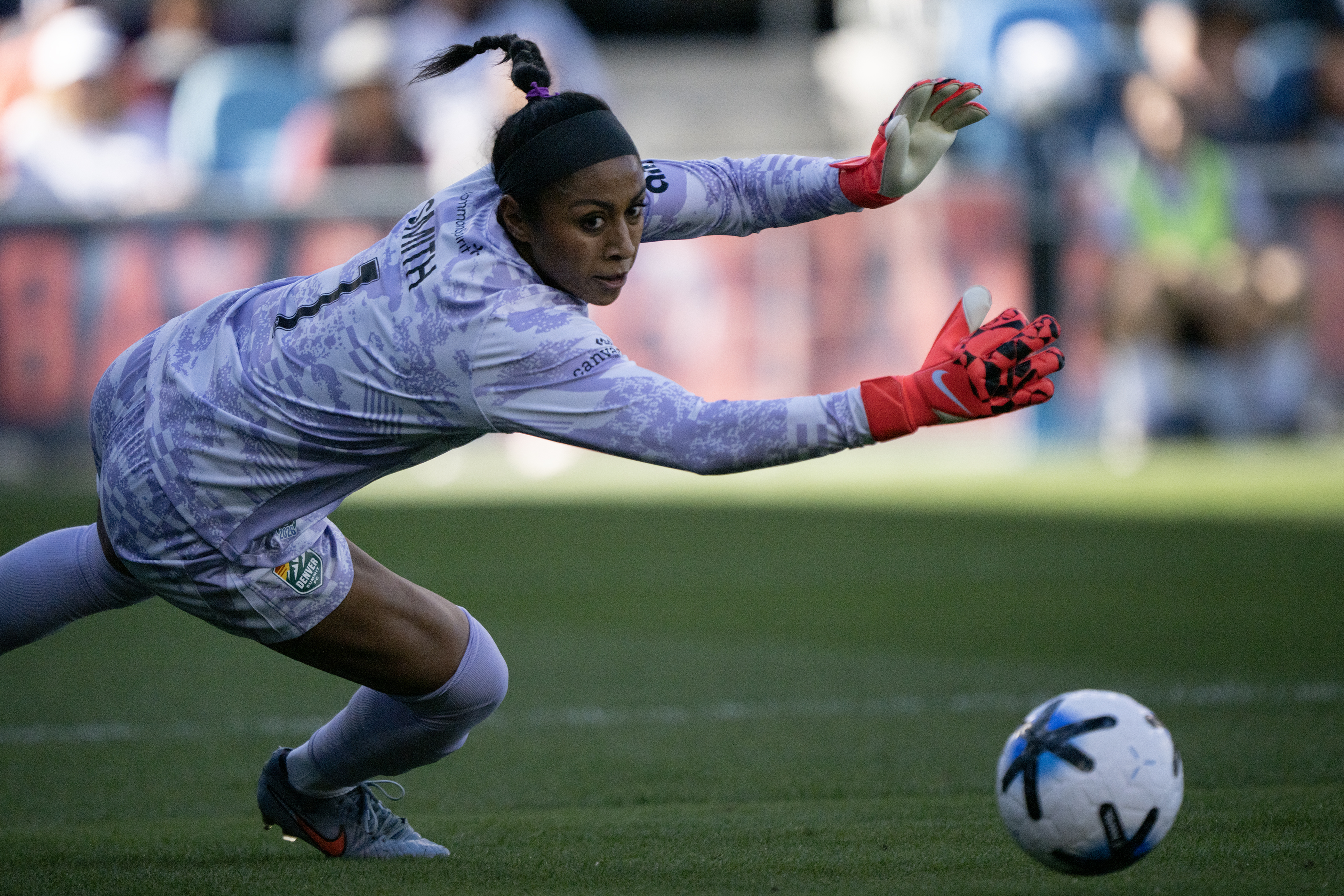 Abby Smith (1) of the Denver Summit FC is scored...