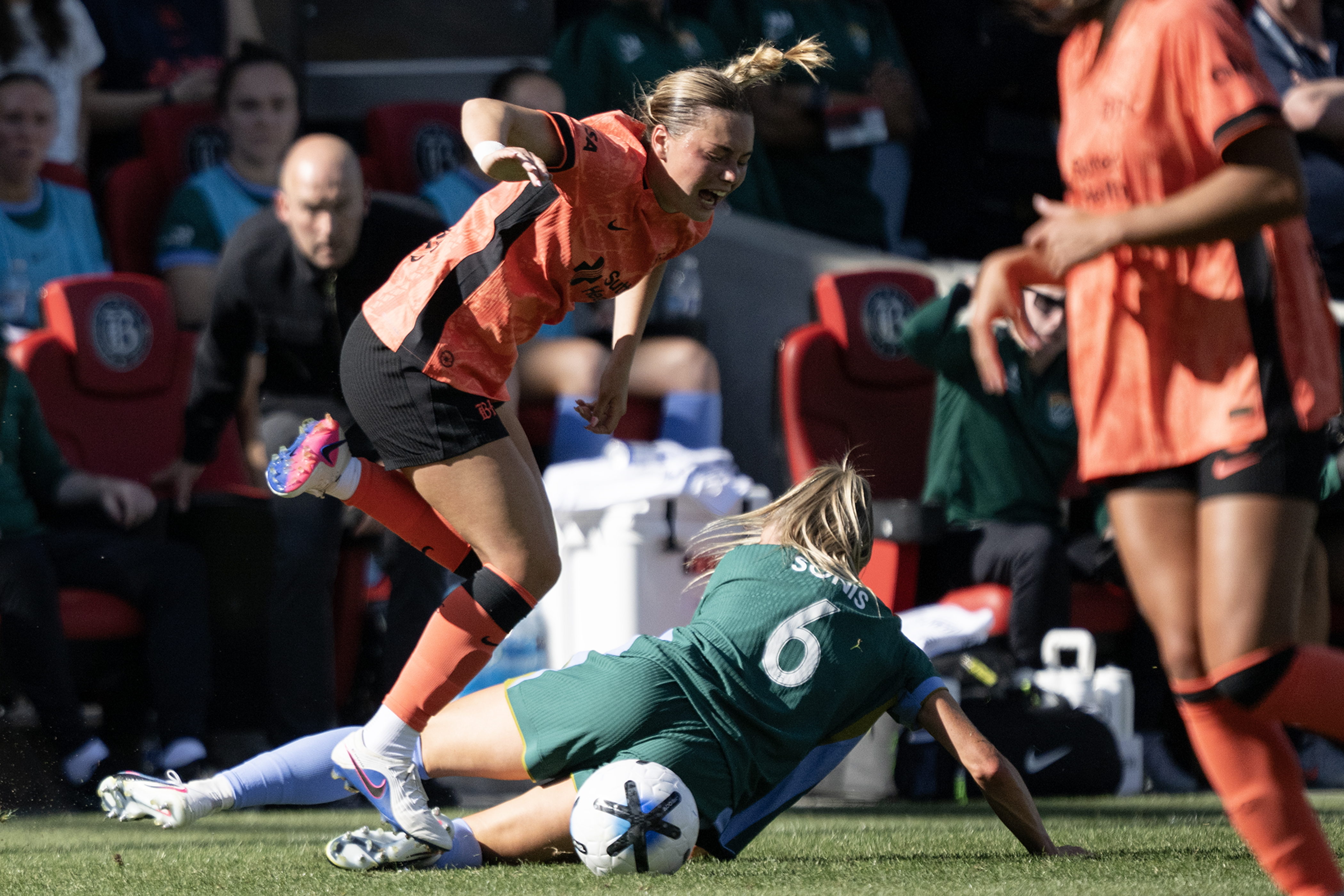 Janine Sonis (6) of the Denver Summit FC slide tackles...