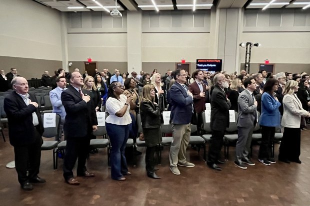 crowd reciting the pledge of allegience