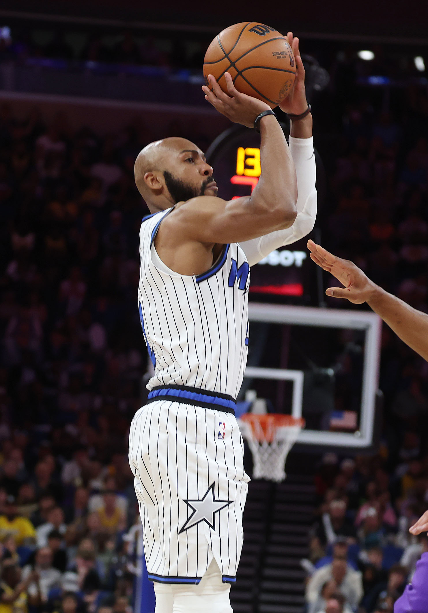Orlando guard Jevon Carter shoots a three point shot during...