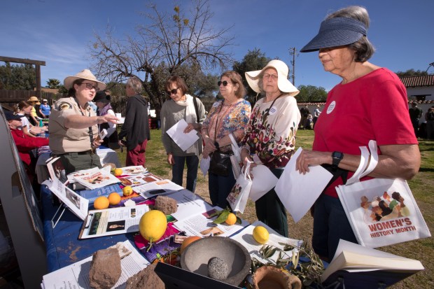 April Farnham, a California State Parks interpreter, talks about famous author, Maria Amparo Ruiz de Burton, as Phyllis Gallaway of Santa Rosa, right, Patty Peterson, center right, and Karen Garcia, third from right, both of Napa, all listen during the Second Annual Women's History Crawl in celebration of Women's History Month at Sonoma State Historic Park in Sonoma, Saturday, March 7, 2026. (Darryl Bush/For The Press Democrat)