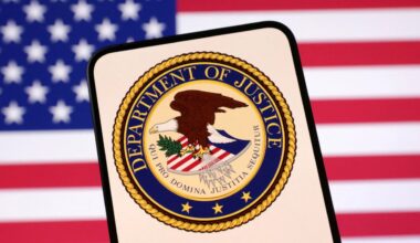 United States Department of Justice logo and U.S. flag are seen in this illustration taken April 23, 2025. REUTERS/Dado Ruvic/Illustration/File Photo