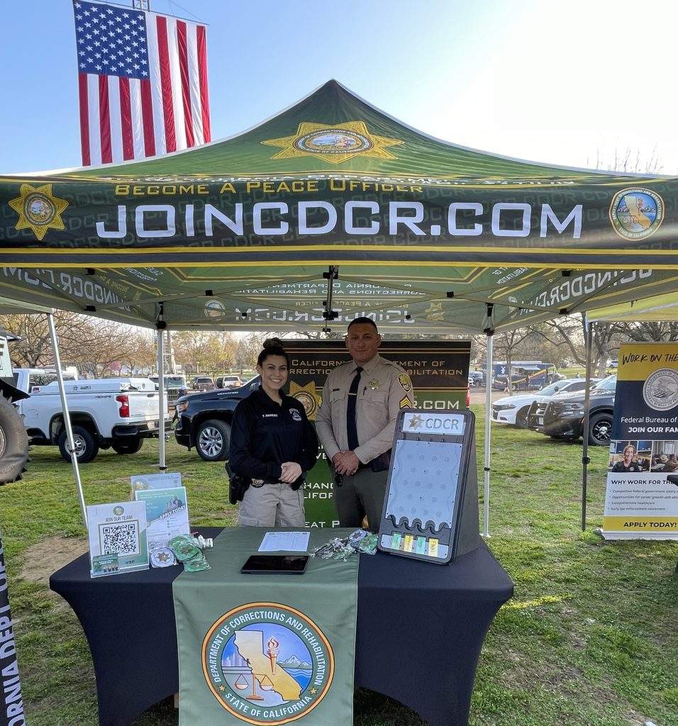 Recruiters at a booth.