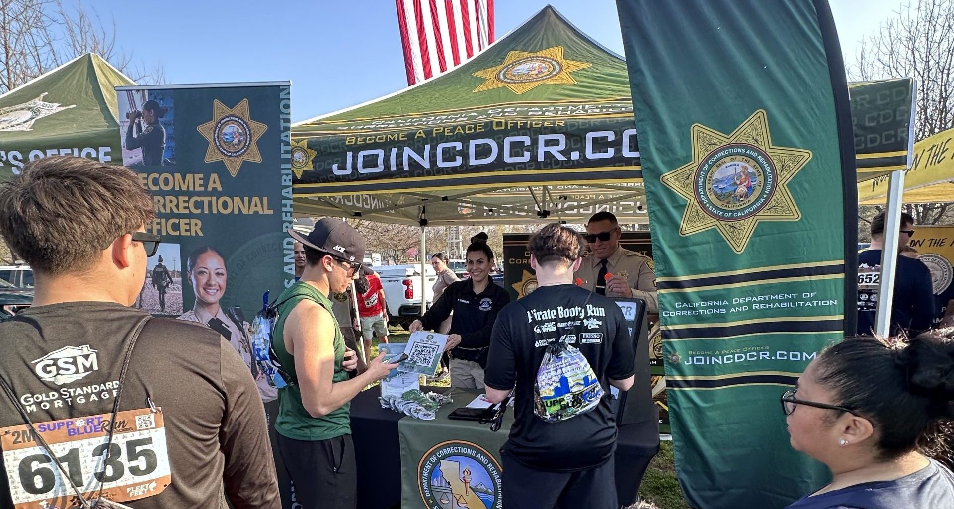 Public members speak with VSP recruiters at the Fresno Support Blue Run.