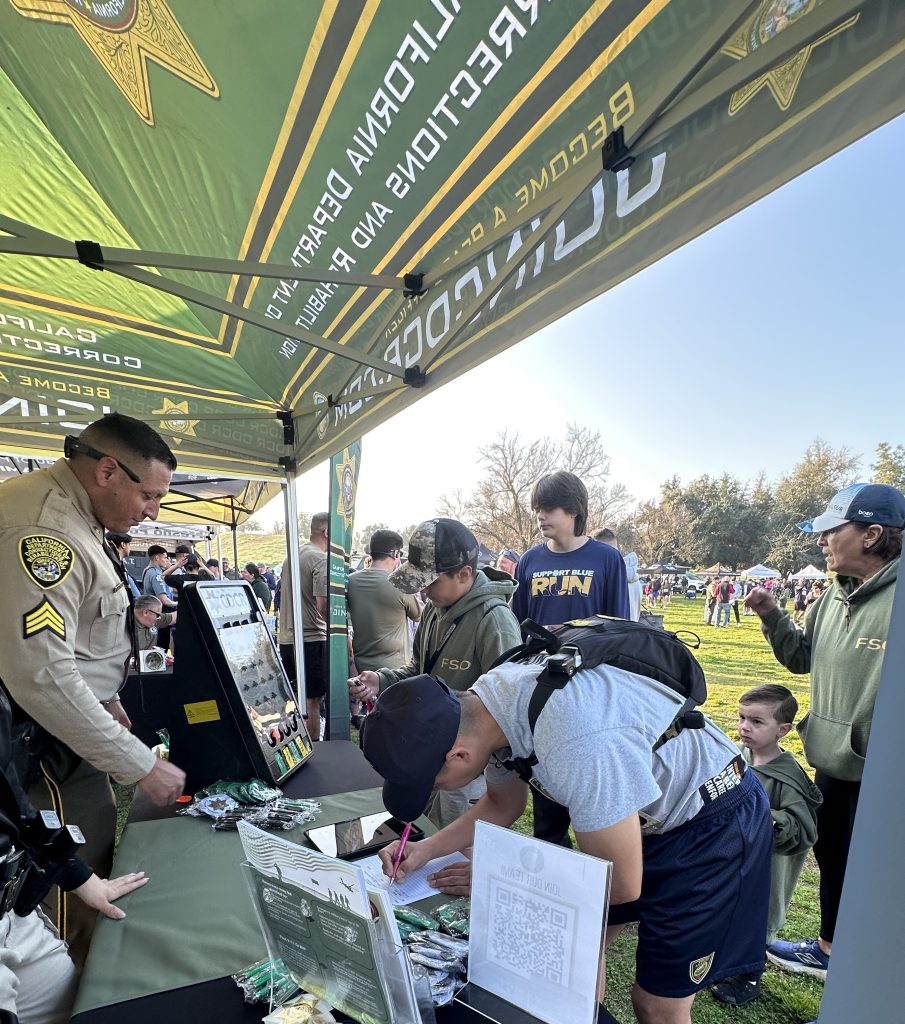 Recruiters interact with the public in Fresno.