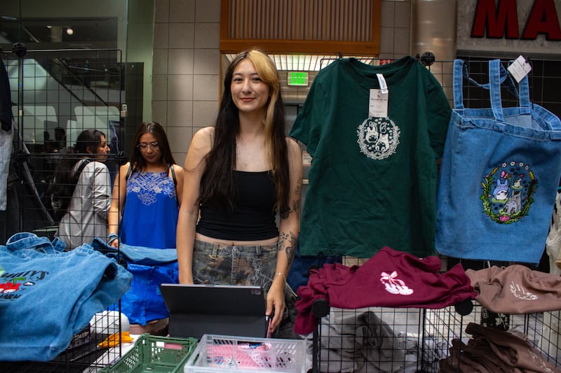 Person selling clothes and merch