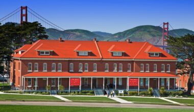 The exterior of the Walt Disney Family Museum with the Golden Gate Bridge in the background.