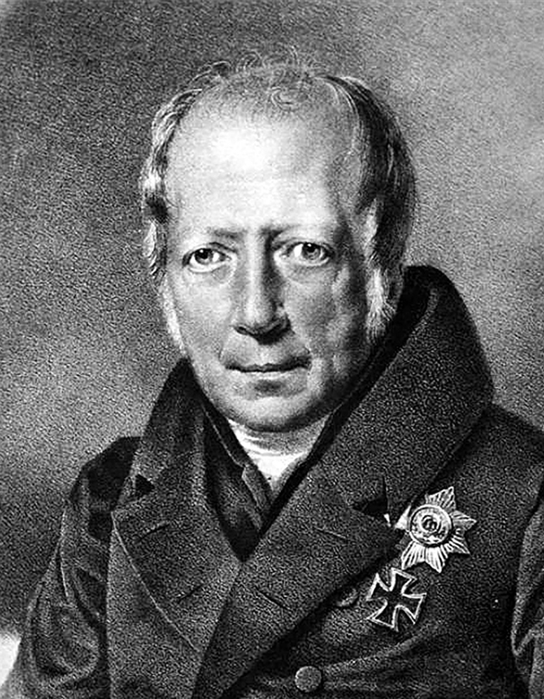 A black and white lithograph of Wilhelm von Humboldt, in the format of a headshot, with a military medal adorning his jacket.