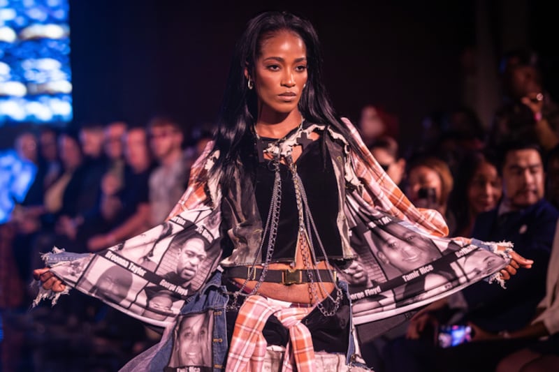 DESCRIBE THE IMAGE FOR ACCESSIBILITY, EXAMPLE: Photo of a chef putting red sauce onto an omelette.