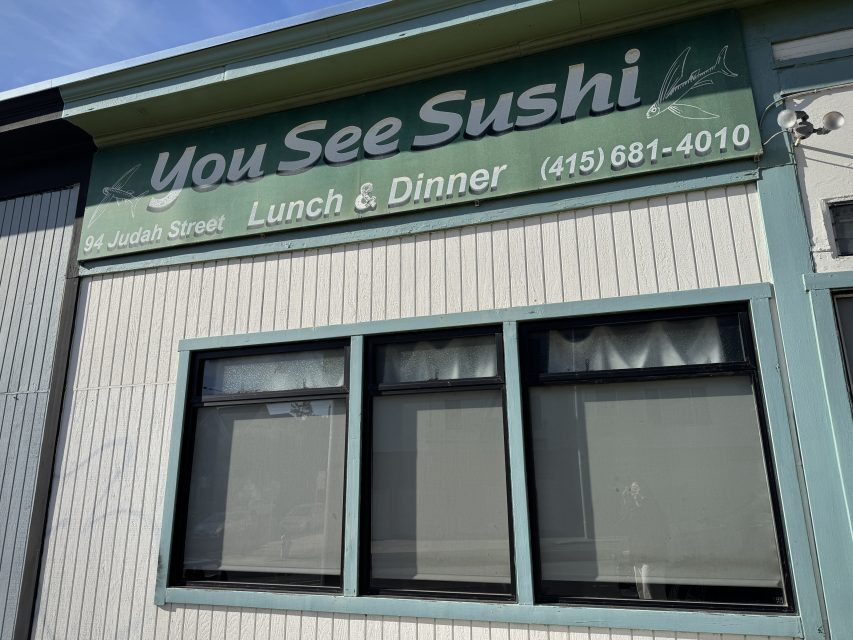 A green and white storefront sign reads "You See Sushi," with the address 94 Judah Street and a phone number. The sign mentions "Lunch & Dinner." Three windows are below the sign.