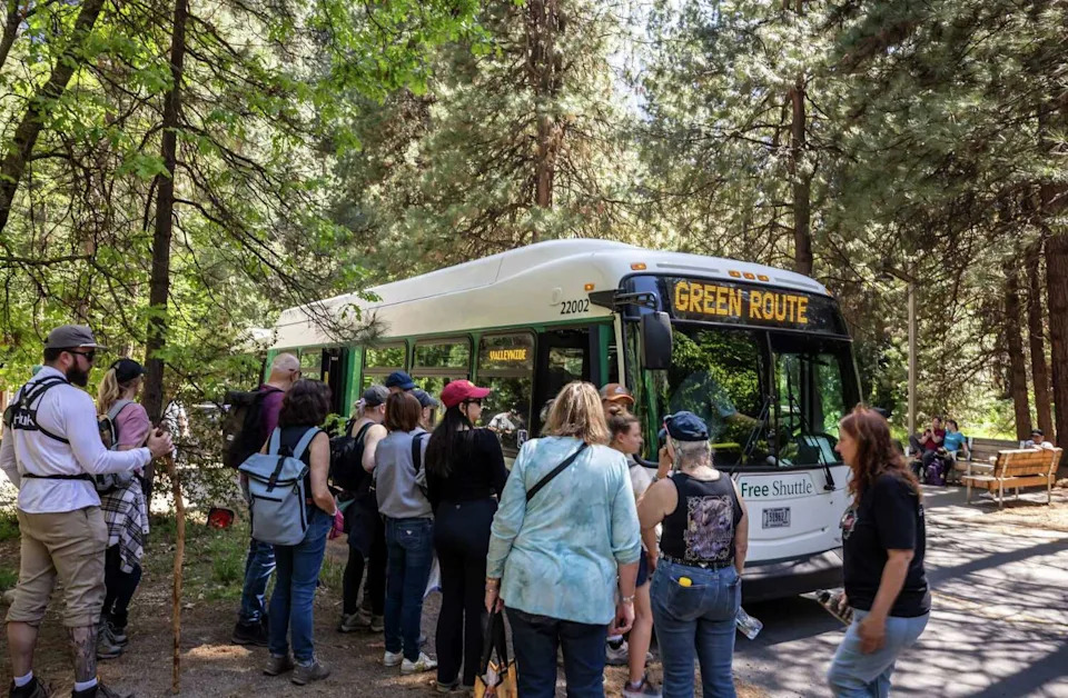 Visitors board buses in Yosemite National Park last May. The strong park visitation numbers came during one of the most turbulent periods in recent memory for the park service. (Carlos Avila Gonzalez/S.F. Chronicle)