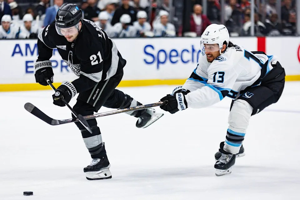 Los Angeles Kings center Scott Laughton (#21) attempts to shoot the puck during an NHL match against the Utah Mammoth on March 28, 2026 in Los Angeles, California.