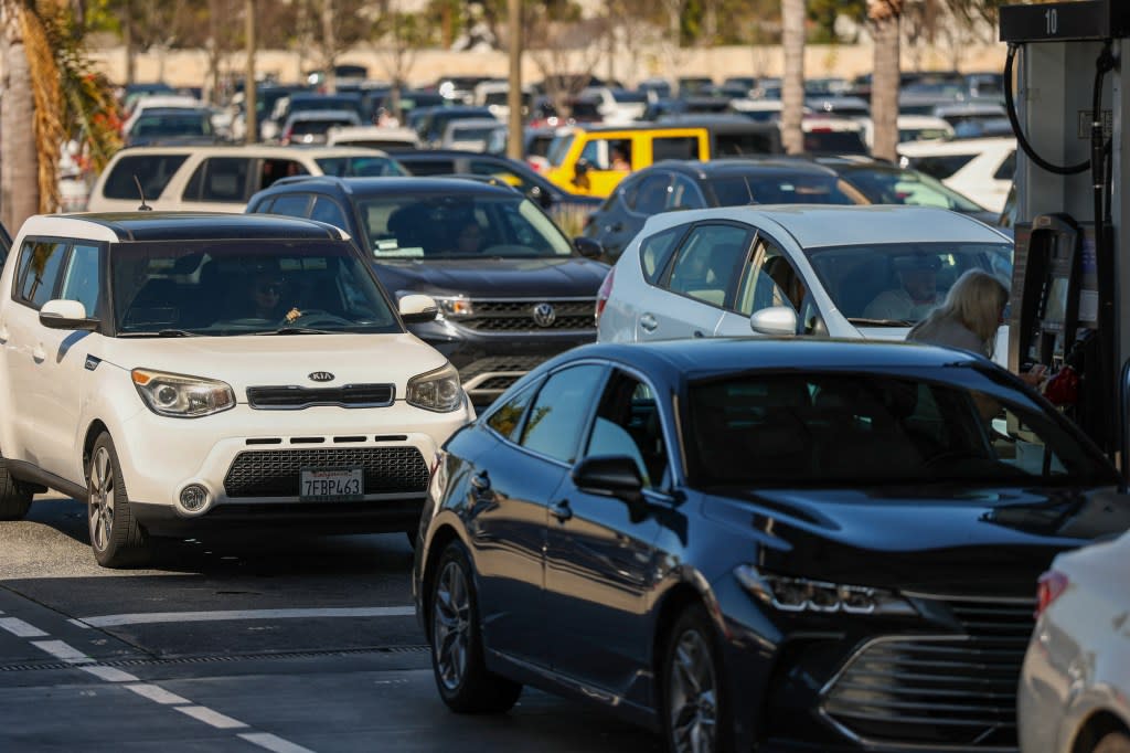 Drivers wait in lines to pump gasoline into their vehicles at a gas station in Marina del Rey, Los Angeles on March 2. AFP via Getty Images