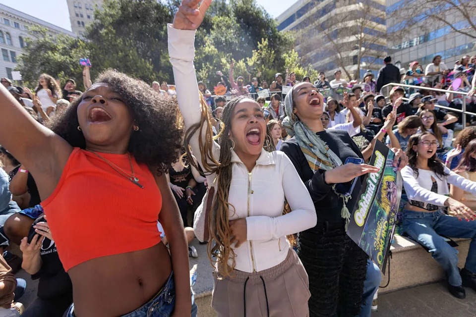 Attendees cheer during the Alysa Liu Celebration Rally at Frank Ogawa Plaza in front of Oakland City Hall in Oakland, Calif., on March 12, 2026. (Douglas Zimmerman/SFGATE)