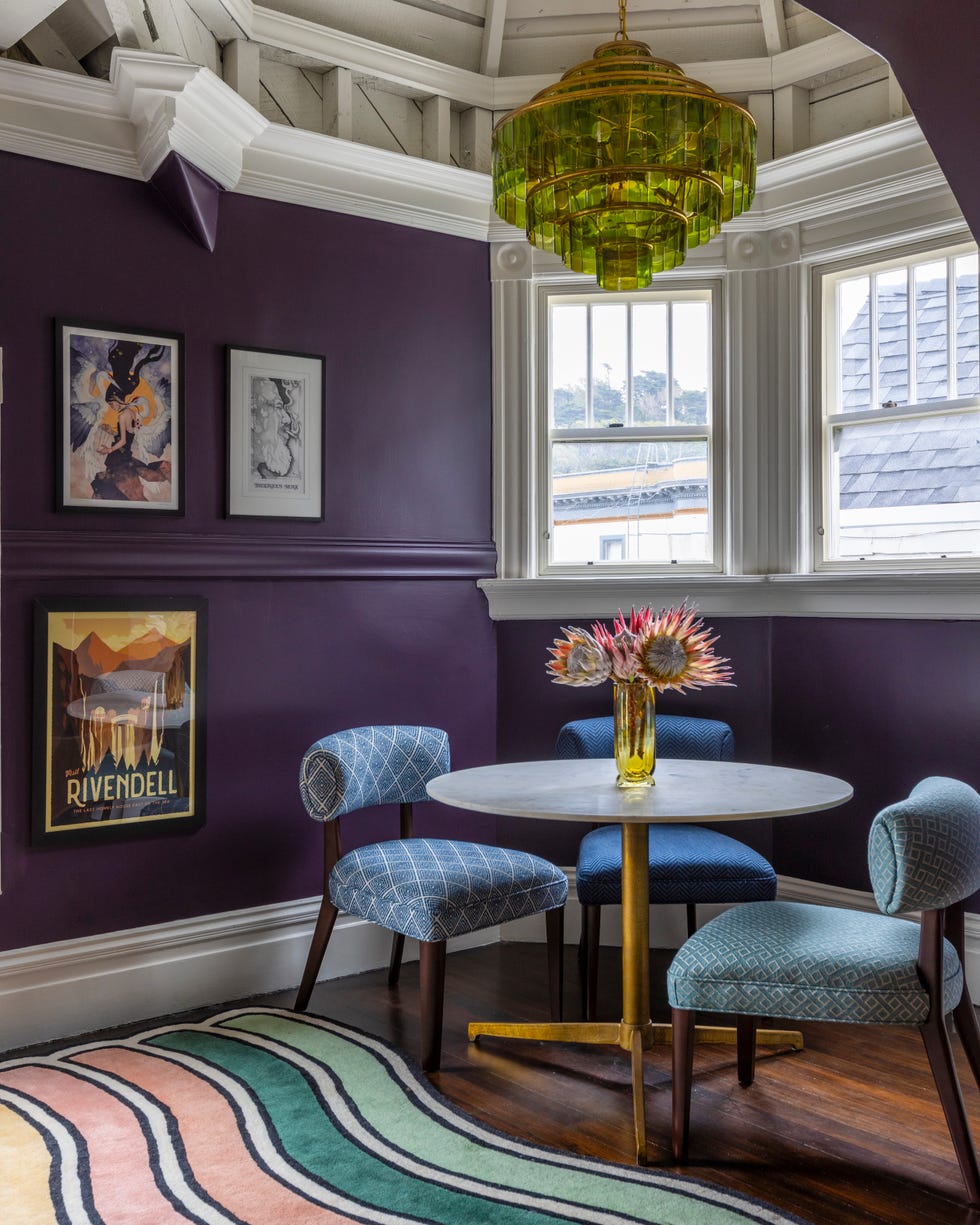Cozy corner dining area with a round table and decorative elements.