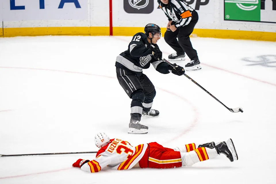 Los Angeles Kings left wing Trevor Moore (12) unsuccessfully taking a shot at goal during an NHL hockey game against the Calgary Flames on February 26th, 2026 in Los Angeles, CA.