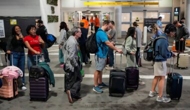 Airline passengers wait in long lines outside the terminal to get through the TSA security screening at William P. Hobby Airport in Houston, Sunday, March 8, 2026. (Brett Coomer/Houston Chronicle via AP)