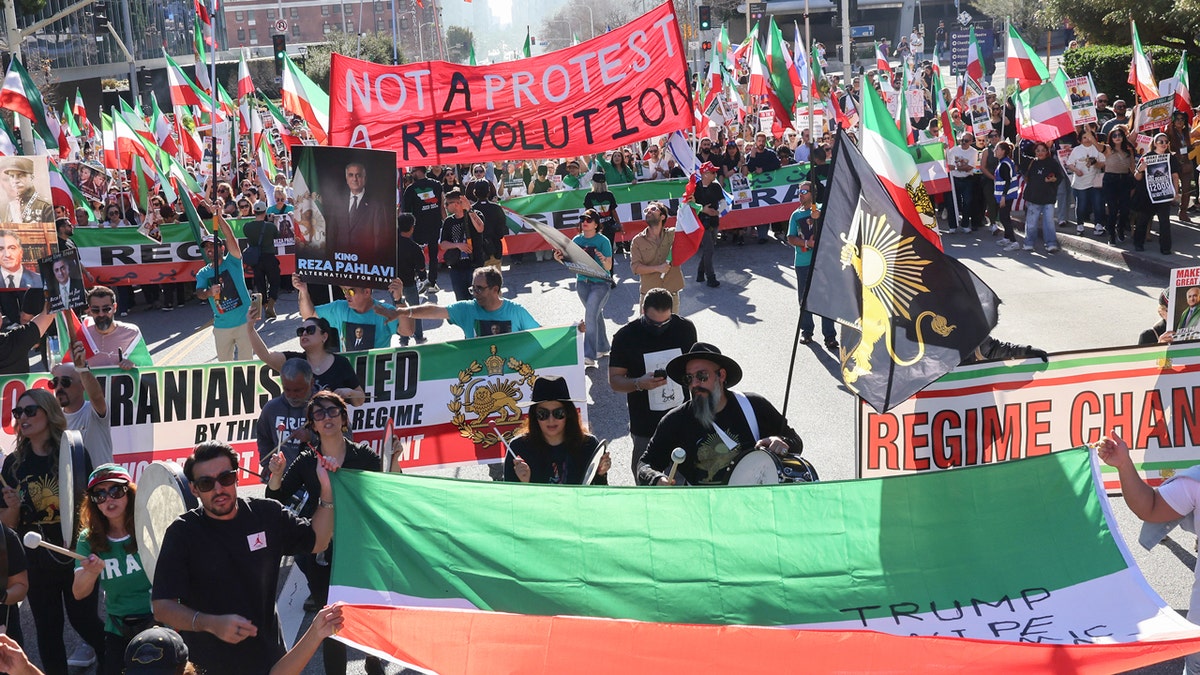 Anti-Iranian regime protesters holding signs and flags in Los Angeles 