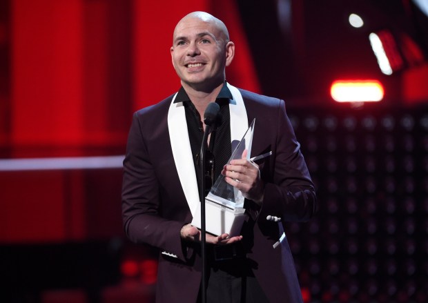 Pitbull will be performing live at North Island Credit Union Amphitheatre in Chula Vista on May 29. (Photo by Chris Pizzello/Invision/AP)