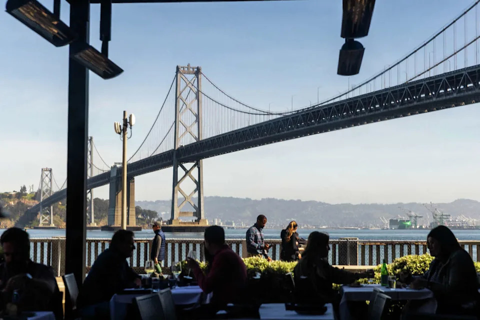 Customers dine at Waterbar with the San Francisco-Oakland Bay Bridge in the background in San Francisco, on March 10, 2026. (Douglas Zimmerman/SFGATE)