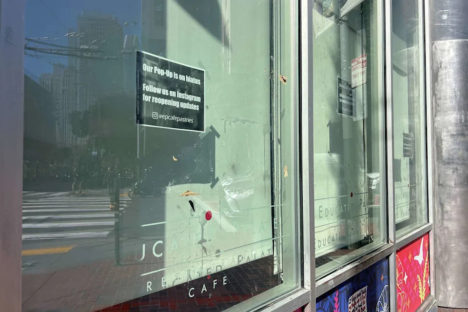 A sign in the window of Educated Palate announces a hiatus of its popular pop-up. (Amanda Bartlett/SFGATE)