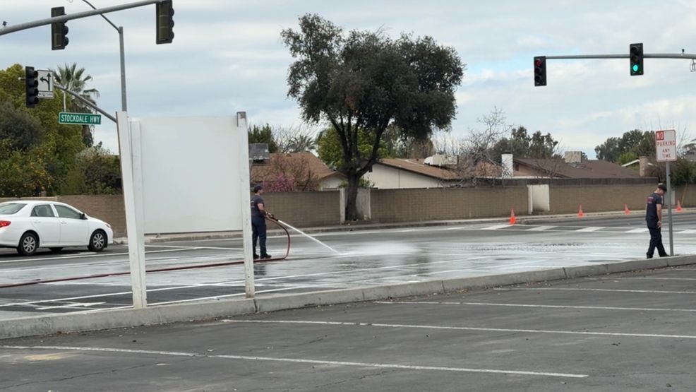 Fire crews sprayed down Stockdale Highway after no hazardous material was found from an item that fell off a truck. PHOTO: KBAK/KBFX