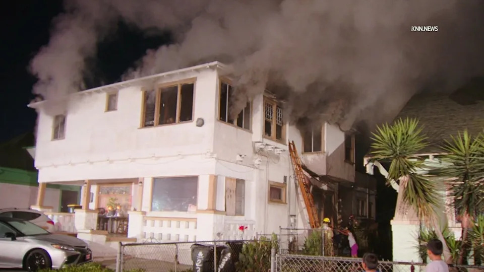 Crews respond to a fire with reports of people trapped in Historic South-Central