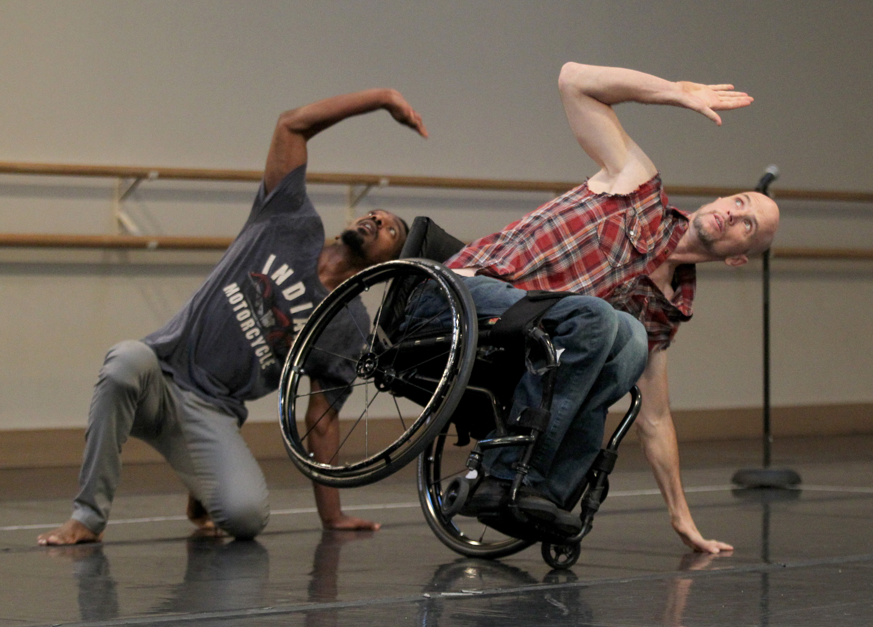 Dwayne Scheuneman, right, and James Bowen, left, dance during a...