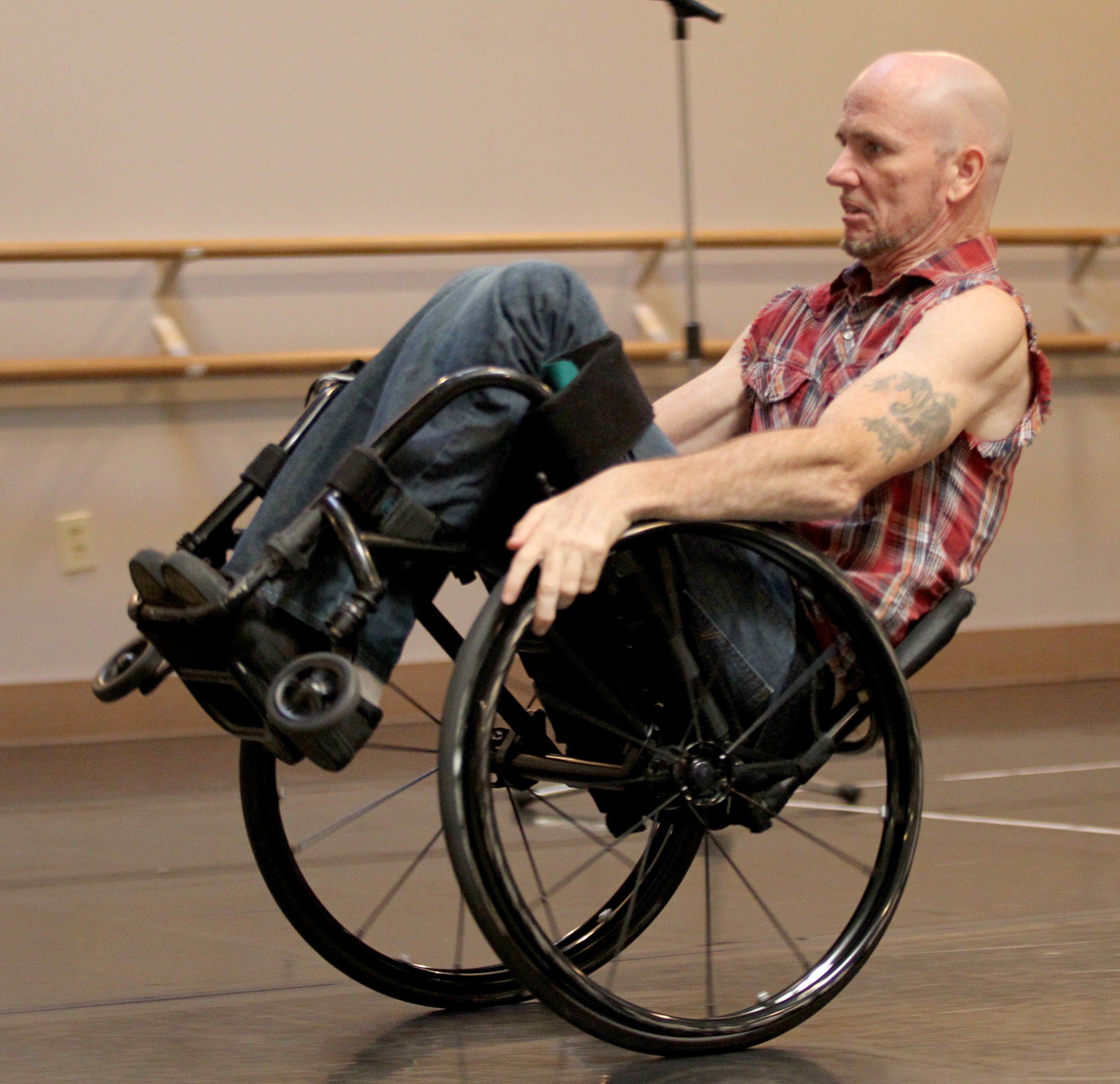 Dwayne Scheuneman dances during a performance by the Axis Dance...