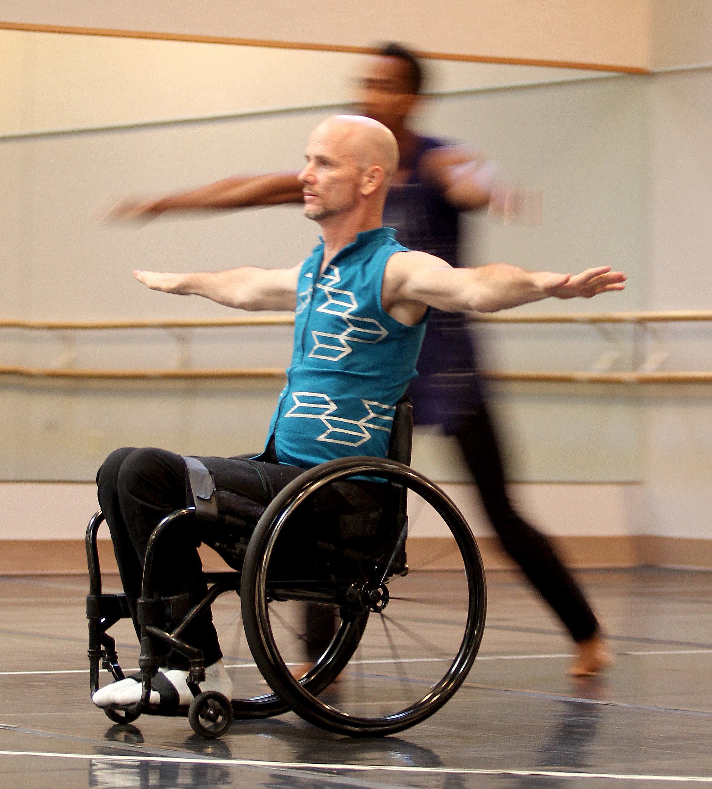 Dwayne Scheuneman dances during a performance by the Axis Dance...