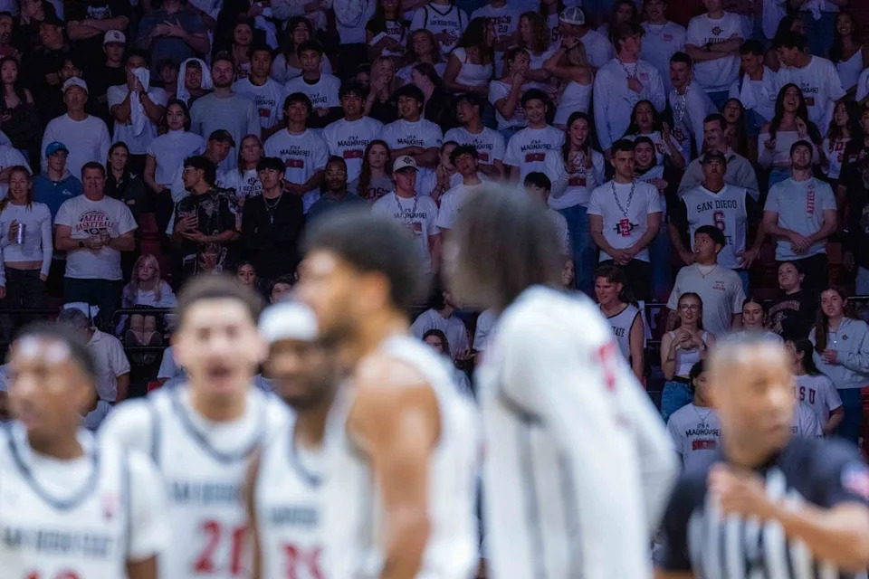 San Diego State fans wear white during an NCAA Basketball game between UNLV and San Diego State, Friday March 6, 2026 at Viejas Arena in San Diego, Calif.