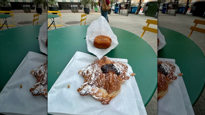Blackberry, almond, hazelnut croissant, and kouign-amann on a table